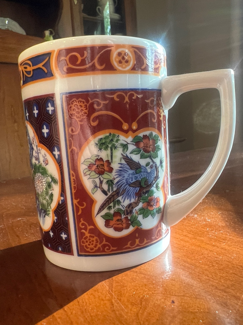 Vintage Japanese Imari ware porcelain mug with bird and floral motif